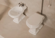 BOHEME High-Level cistern with WC and bidet in a bathroom setting – Alice Ceramica