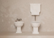 BOHEME Low-Level cistern with WC and bidet in a bathroom setting – Alice Ceramica