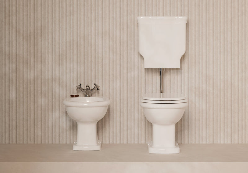 BOHEME Low-Level cistern with WC and bidet in a bathroom setting – Alice Ceramica