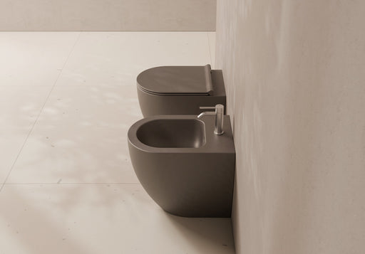 FORM 50 Back-to-Wall WC and bidet in a bathroom setting – Alice Ceramica
