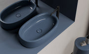 IDILLA Oval Countertop Washbasin 60x35 in a bathroom setting – Alice Ceramica
