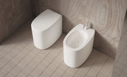 IDILLA Back-to-Wall WC and bidet in a bathroom setting – Alice Ceramica