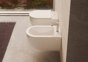 UNICA 55 Wall-Hung WC and bidet in a bathroom setting – Alice Ceramica